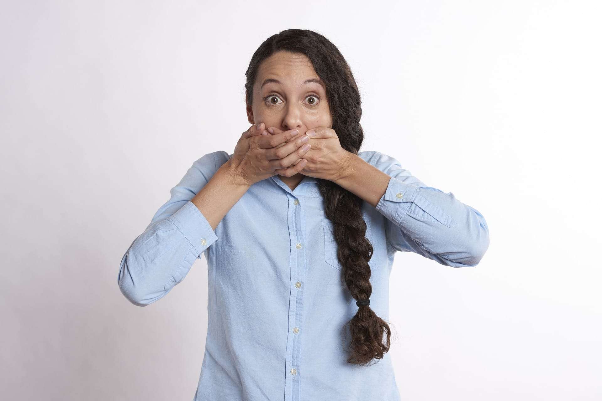 Image of a girl covering her mouth image for the article Website Building Secrets: The Steps You Need to Take to Create a Successful Website